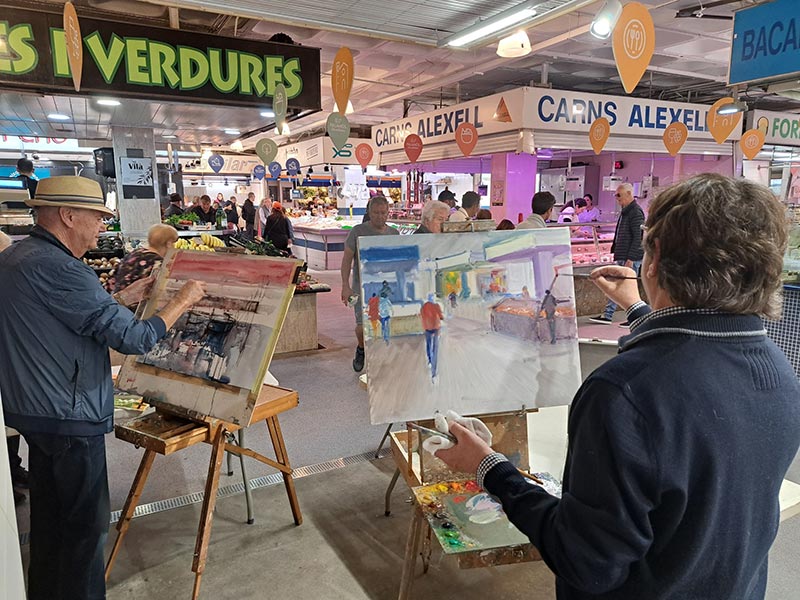 Tres pintors palamosins van fer ahir una demostració de la seva tècnica al Mercat Municipal. (Foto: Ajuntament de Palamós).